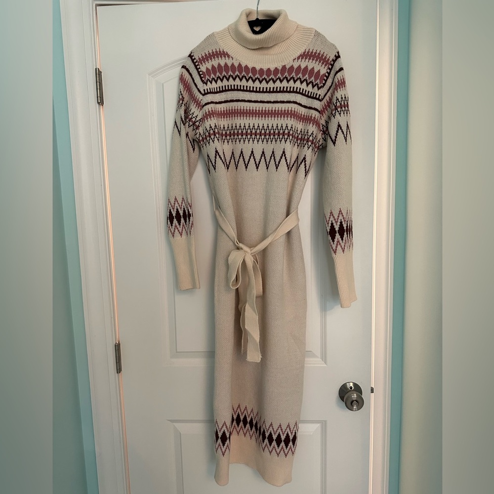 Small sweater dress. NEW WITH TAGS. Never been worn.
